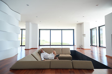 Image showing Portrait of senior man relaxing in sofa