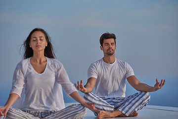 Image showing young couple practicing yoga