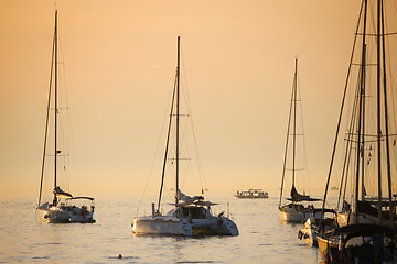 Image showing Anchored sailboats at sunset in Adriatic sea