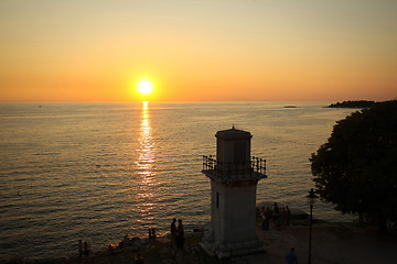 Image showing Tourists watching sunset on Adriatic coast