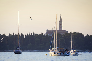 Image showing Sailboats in front of Saint Eufemia church