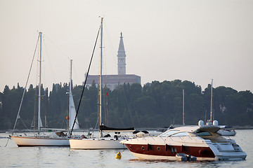 Image showing Saint Euphemia bell tower and anchored sailboats