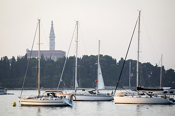 Image showing Anchored sailboats in front of Saint Euphemia bell tower