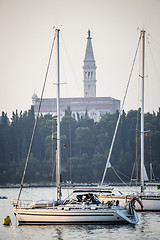 Image showing Anchored boats in front of Saint Euphemia bell tower