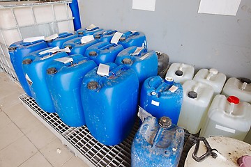 Image showing Plastic cans of chemicals