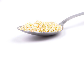 Image showing Millet flakes on spoon