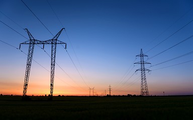 Image showing Large transmission towers at blue hour 