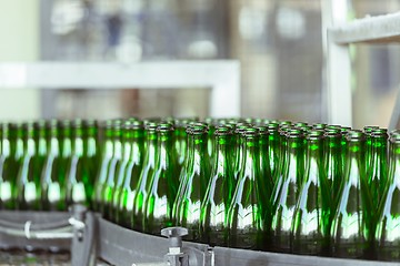 Image showing Many bottles on conveyor belt