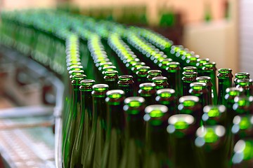 Image showing Many bottles on conveyor belt