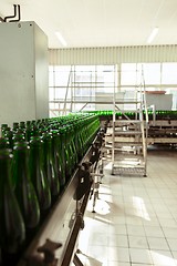 Image showing Many bottles on conveyor belt