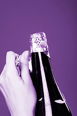 Image showing Opening champagne bottle