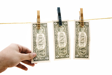 Image showing Dollars on the wire