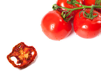 Image showing Bunch of raw tomatoes with water drops and dried slice