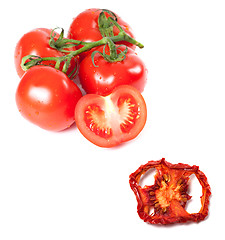 Image showing Bunch of fresh tomatoes with water drops and dried slice