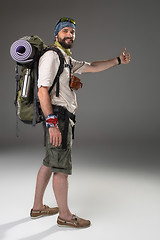 Image showing Full length portrait of a male fully equipped tourist 