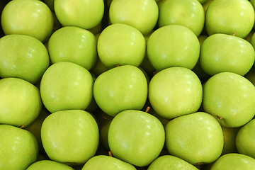 Image showing neatly folded green apples