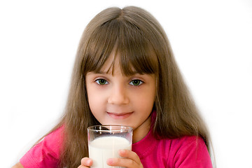 Image showing The girl drinks milk