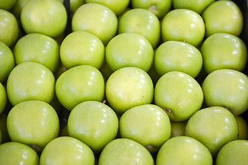 Image showing neatly folded green apples