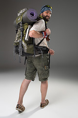 Image showing Full length back view of a male fully equipped tourist 