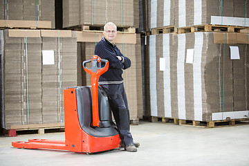 Image showing Worker Standing Arms Crossed At Warehouse