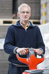 Image showing Confident Worker Standing At Warehouse