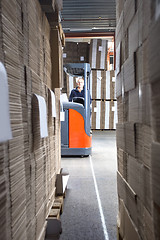 Image showing Worker In Forklift Seen From Stockpiles