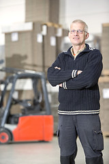 Image showing Happy Worker Standing At Warehouse