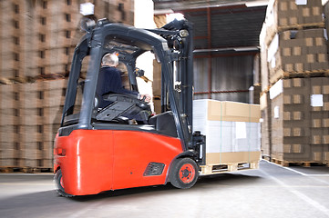 Image showing Worker Carrying Stock On Forklift