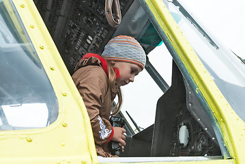 Image showing Girl sits in cabin of MI-8 helicopter