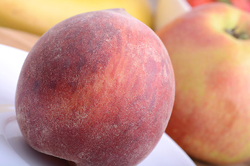 Image showing peach,  apple and strawberry on wooden plate 