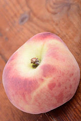 Image showing peaches on the wooden background