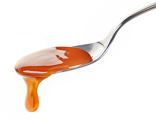 Image showing spoon of caramel sauce