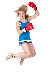 Image showing Pretty girl in boxing gloves at jump