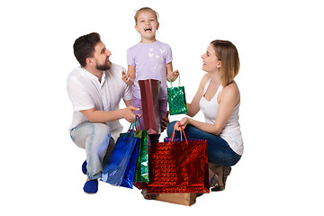 Image showing Happy family with shopping bags standing at studio 