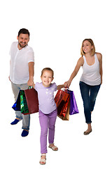 Image showing Happy family with shopping bags standing at studio 