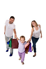 Image showing Happy family with shopping bags standing at studio 