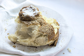 Image showing Snapped loaf of traditional bread and salt