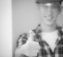 Image showing builder shows his hand, that all is well