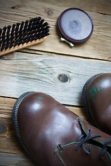 Image showing boots, shoe polish and shoe brush