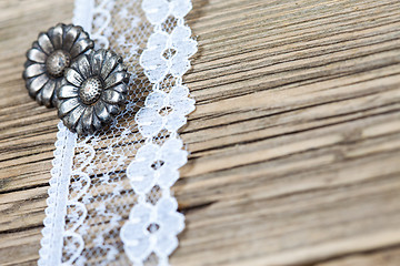 Image showing vintage button and lace tape