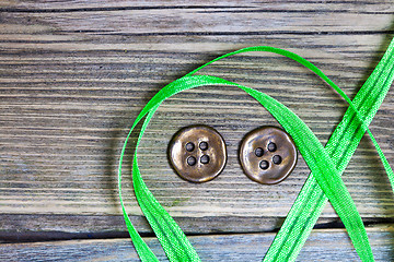 Image showing still life with old green tape and two vintage buttons