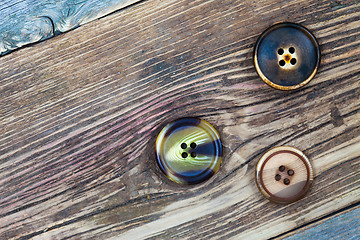 Image showing three aged buttons