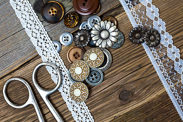 Image showing vintage buttons, lace, and a dressmaker scissors