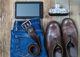 Image showing digitizer, rangefinder camera, brown boots, leather belt and blu