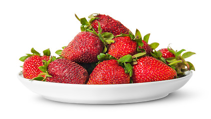 Image showing In front pile of fresh juicy strawberries on white plate