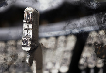 Image showing M hammer - old manual typewriter - mystery smoke