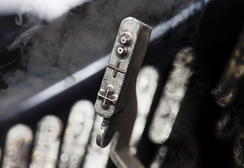 Image showing Add hammer - old manual typewriter - mystery smoke