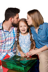 Image showing Happy family with shopping bags sitting at studio 