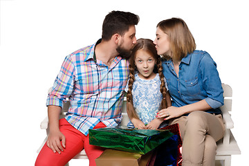 Image showing Happy family with shopping bags sitting at studio 