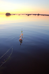 Image showing Sunset river perch fishing with the boat and a rod